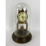 An early 20th century Gustav Becker anniversary clock with glass dome, the movement numbered 268031,