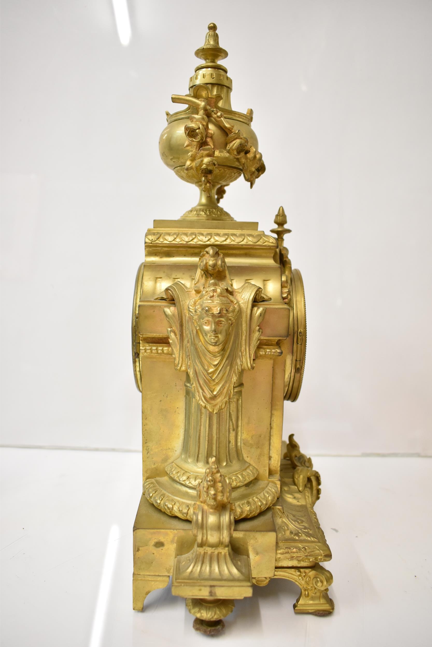 A 19th century French gilt metal mantel clock, the case having an urn shaped finial with floral - Image 2 of 6