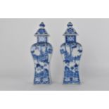 A pair of 18th century Chinese porcelain blue and white vases and covers of rectangular waisted form