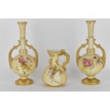 A pair of Royal Worcester blush ivory glazed porcelain twin handled vases, 27cm high, together