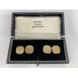 A pair of 9ct gold octagonal shaped chain link cufflinks having machine engraved decoration,