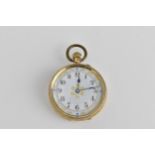 A late 19th/early 20th century 14ct gold fob watch in an engine turned case with white dial having