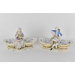 A pair of 19th century Meissen porcelain figural sweetmeat dishes, with blue crossed swords mark and