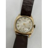 An Everite 1950s gents 9ct gold manual wind wristwatch having a silvered dial with baton and