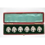 A set of six Edwardian silver buttons, London 1901-1903 by Samuel Jacobs with mask and scrolled