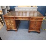 A 20th century Georgian style mahogany partners pedestal desk with leather scriber above six drawers