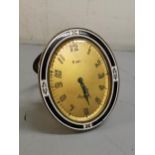 An Art Deco Asprey brass and enamel 8-day alarm clock, 9cm high Location: Port