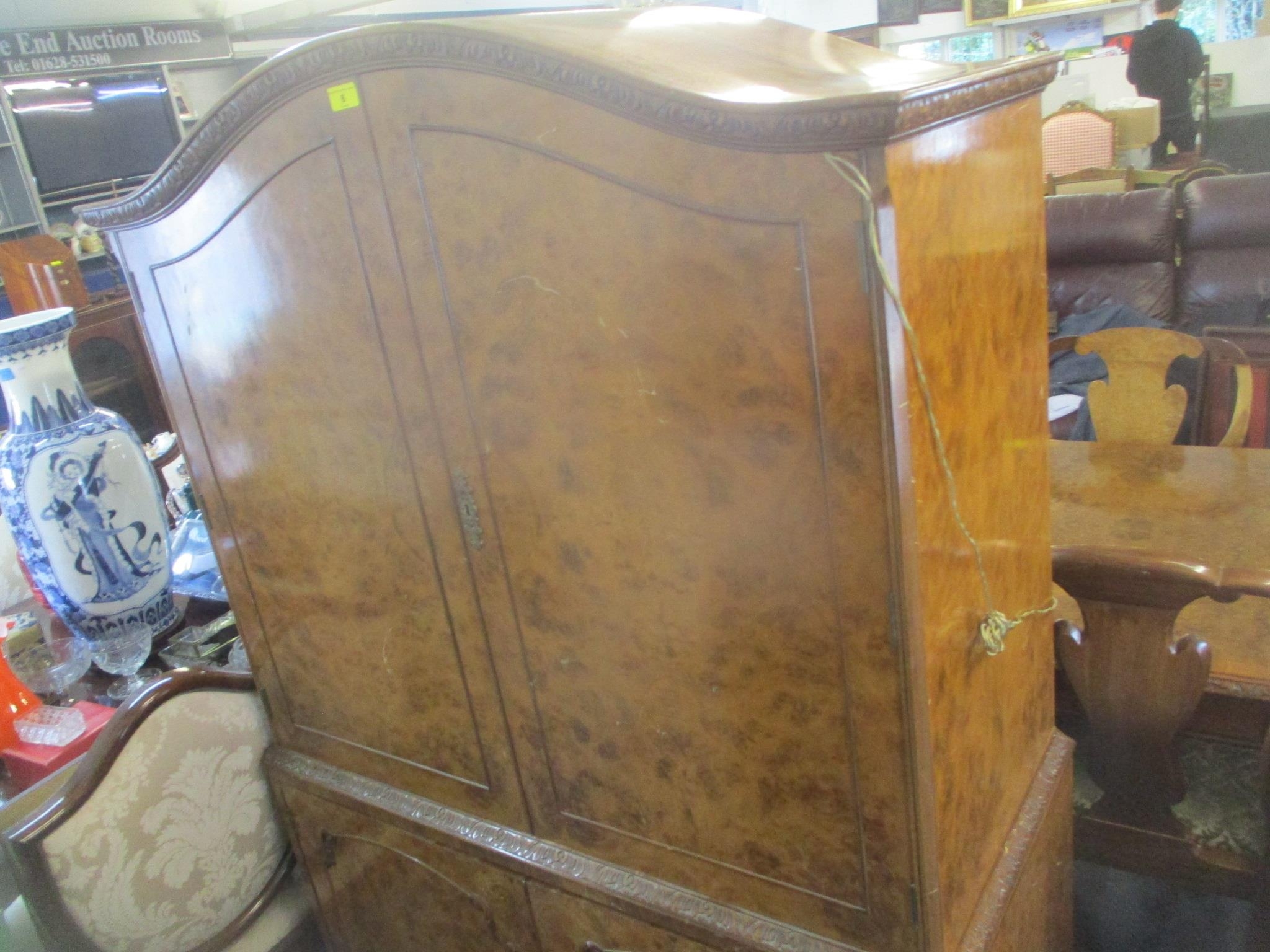 A 1950's walnut cocktail cabinet having four cupboard doors with fitted interior standing on short - Image 2 of 4