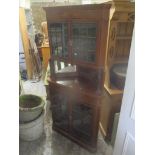 An Edwardian mahogany corner cabinet having marquetry inlaid with four glazed doors Location: