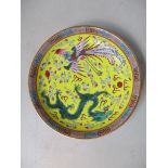 A Chinese porcelain large famille rose export saucer dish decorated with a dragon and a phoenix