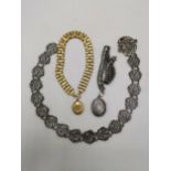 A Victorian silver belt together with a silver locket on white metal chain and a pinchbeck and