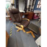 A modern beech swivel armchair and matching stool Location: LAM