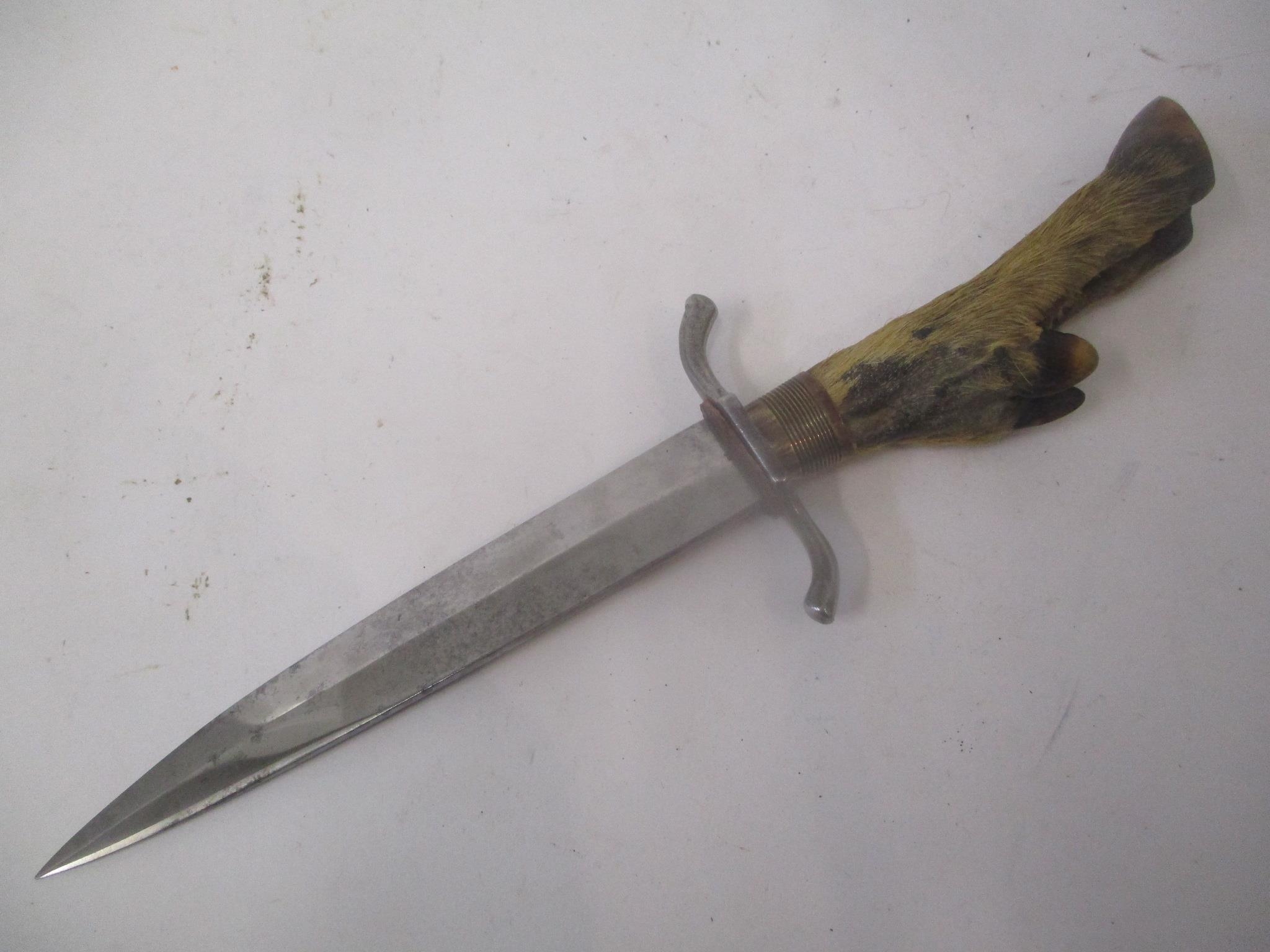 A taxidermy German WW1 trench knife with deer foot handle Location: