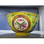 A Chinese famille rose medallion bowl, each medallion containing a group of fruits surrounded by a