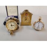 A gold plated pocket watch together with a Swiza clock and modern pocket clocks Location: Port