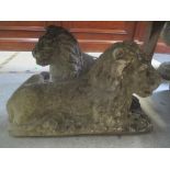 A pair of composition garden ornaments of two recumbent lions, 44cm h x 69cm w Location: