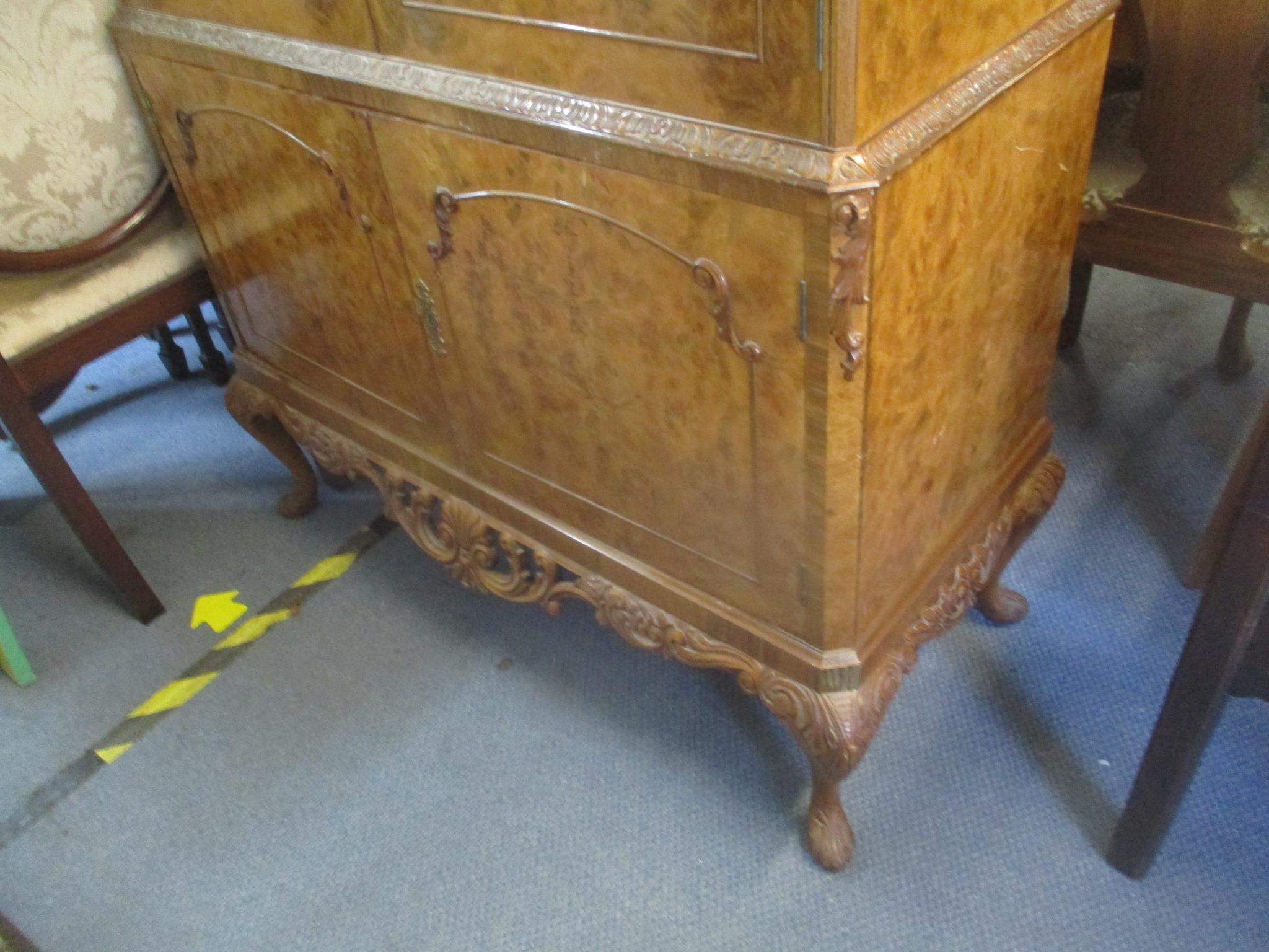 A 1950's walnut cocktail cabinet having four cupboard doors with fitted interior standing on short - Image 3 of 4