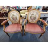 A pair of 20th century Louis XVI style gild wood fauteuils with tapestry upholstered back rests
