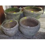 Four composition circular garden planters to include one decorated with grape vines, largest 44cm
