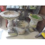 Two composition garden planters decorated with classical figures together with a bird bath Location: