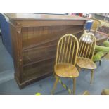 A late 19th/early 20th century oak open bookcase 122cm h x 152cm w, together with a pair of Ercol