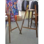 Two varnished vintage wooden easels approximately 120cm h (painting not included) Location: RWM