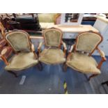 A set of three 20th century Louis XVI walnut fauteuils with velour upholstery, raised on cabriole