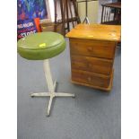 A vintage white enamelled stool with green leather seat A/F 50cm h, together with a modern pine