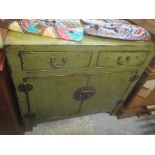 A 20th century Chinese green painted cabinet with two drawers and two doors, 87.5cm h x 94cm w