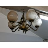 A pair of gilt metal five branch chandeliers with globular glass shades Location: SL