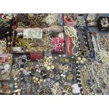 A large collection of 20th century costume jewellery to include pearl and faux pearl necklaces,