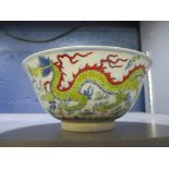 A Chinese porcelain dragon bowl with slightly everted rim, short foot, interior and exterior