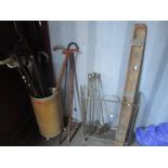 A mixed lot to include fireside implements, screen and mixed walking sticks in a stick stand