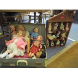 A suitcase containing a selection of 1950s dolls to include a Hugo Wiegand 133 doll, a celluloid