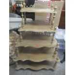 A modern five tier waterfall bookcase having turned columns and pierced fretwork, 139.5cm h x 91.5cm