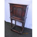 A 1930s oak bedside cabinet having a single linenfold panel door 82.5cm h x 39.5cm w Location: