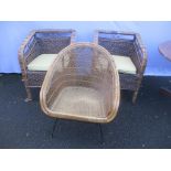 A pair of wicker chairs with cushions in good condition with another vintage example Location: