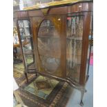 An Edwardian mahogany display cabinet with glazed side panels, on cabriole legs Location: RAB