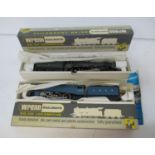 A Wrenn 00 gauge boxed locomotive and a LIMA one, one being a Coronation LMS green King George V (