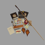 A mixed lot to include two silver mounted brushes, snooker cue, two cribbage boards, coins, a