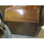 A Georgian mahogany bureau having a fall flap opening to reveal fitted drawers, above four