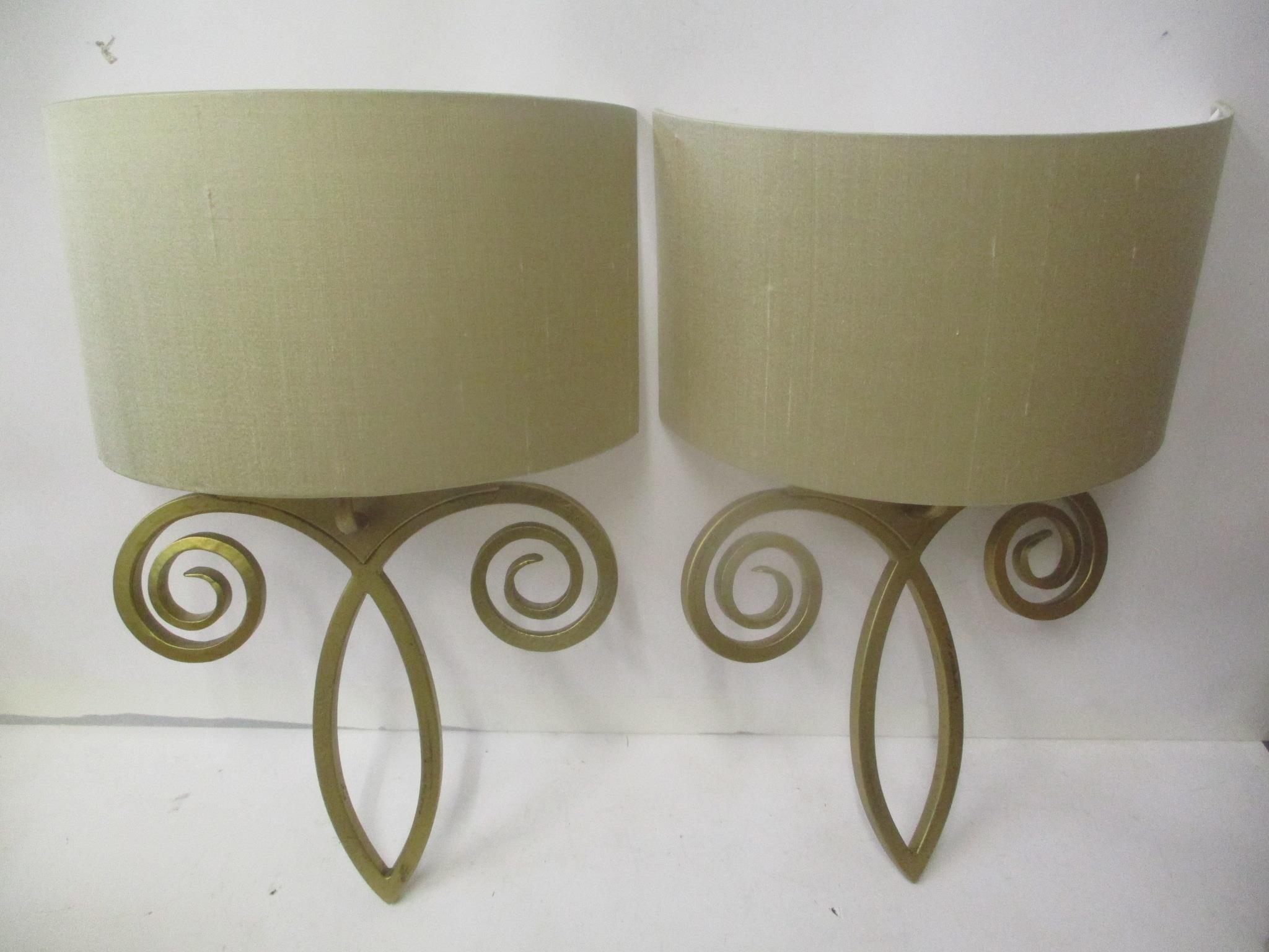A pair of modern Jim Lawrence gilt painted wall lights Location: