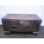 An early 20th century Oriental camphor wood carved chest 47cm h x 92.5cm w Location: