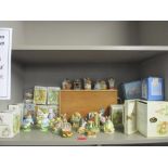 A collection of Beswick Beatrix Potter figurines, some boxed, and two cased book sets of Beatrix