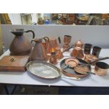 A mixed lot of Victorian and later copper ware to include a Two Gallon jug, jelly moulds, pans and