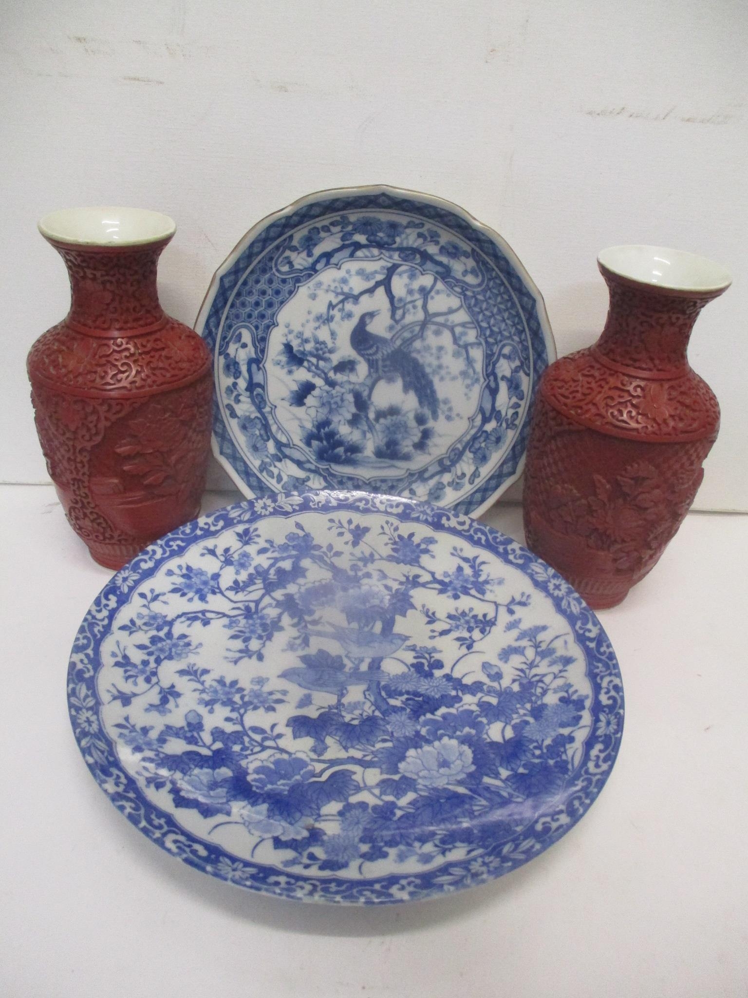 Oriental collectables to include a pair of Chinese cinnabar vases on porcelain, decorated with