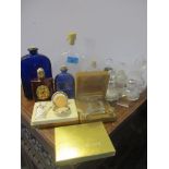 Assorted perfume bottles to include an empty vintage Jean Patou 100 bottle and a pair of silver