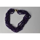 A six row amethyst bead necklace with a magnetic clasp, 46cm long