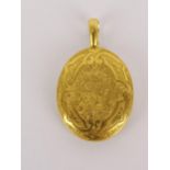A 15ct gold oval locket with floral engraving, 4.5cm high, 19.4g