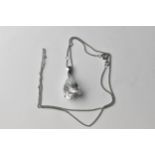 A 9ct white gold pendant set with a pearl shaped white sapphire, on a fine chain, 7.3g